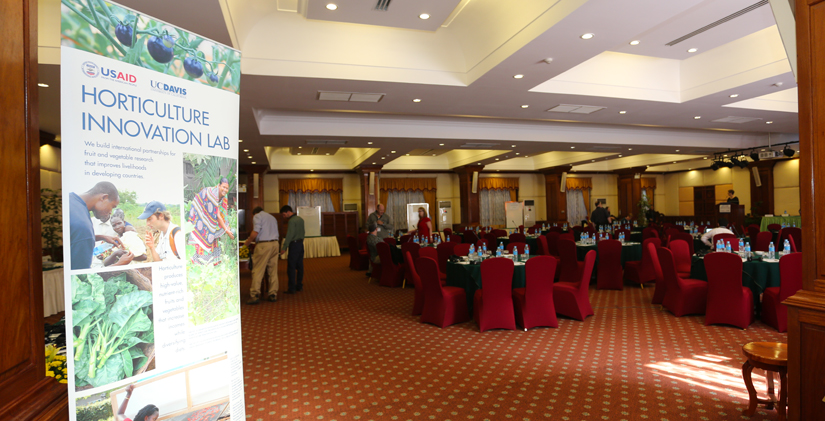 Hotel ballroom with Horticulture Innovation Lab poster in foreground