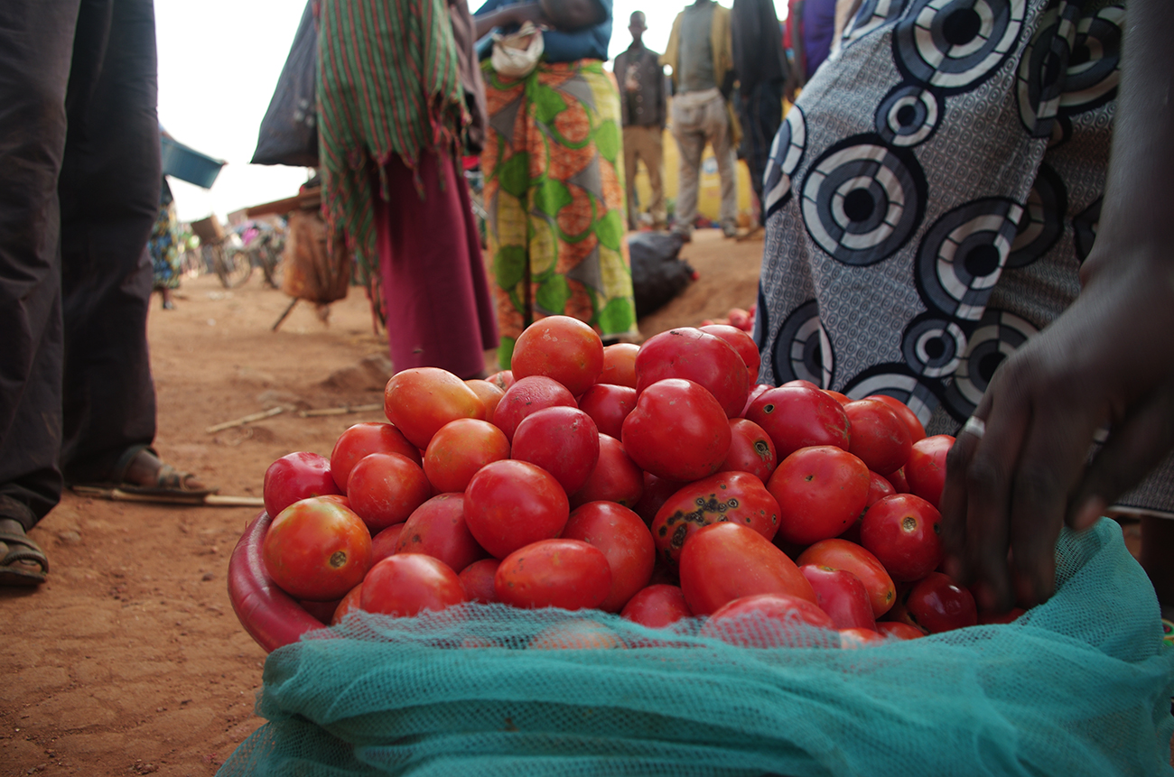 Bin of tomatoes on ground in a market in Rwanda