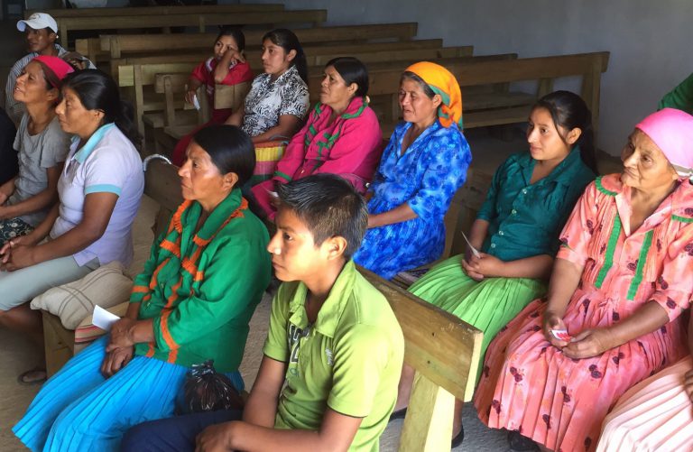 People gathered for meeting in church pews, including you and old, men and women