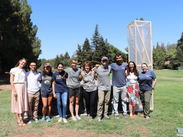 UC Davis group photo with chimney solar dryer
