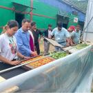 Field officers from FORWARD Nepal join hands with the Sandikharkha Municipality Agriculture Office and local carpenters in a community-driven effort to construct a Chimney Solar Dryer. This collaboration across generations and sectors demonstrates how USAID-supported climate-smart technologies bring communities together for sustainable solutions in postharvest processing. Image credits: Prabin Paudel and Nomraj Sharma.
